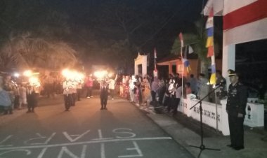 Kapolsek Moro Pimpin Upacara Taptu dan Pawai Obor di Kecamatan Moro