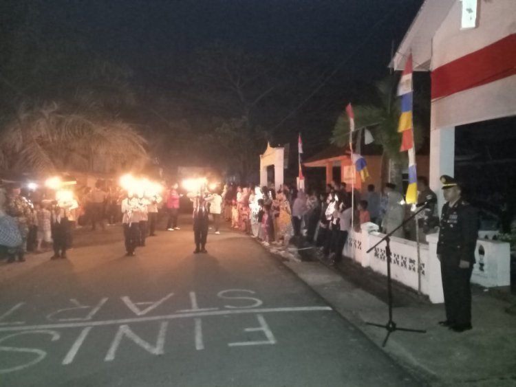 Kapolsek Moro Pimpin Upacara Taptu dan Pawai Obor di Kecamatan Moro
