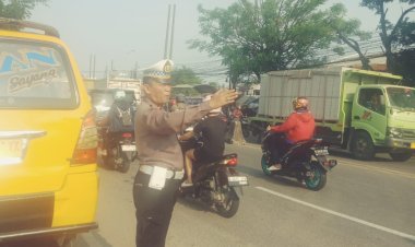 Kegiatan Pengaturan Lalu Lintas Polsek Cikupa: Upaya Menciptakan Keamanan dan Ketertiban di Jalan Raya Serang